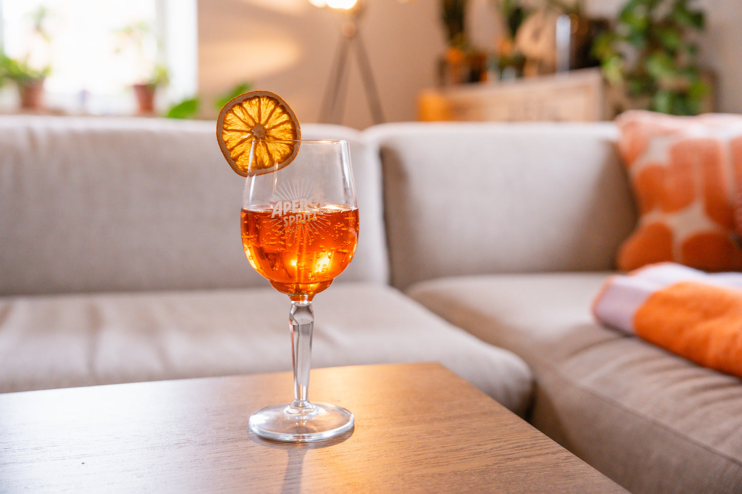 Aperol Spritz candle in a cozy livingroom