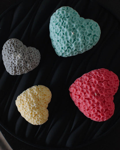 Four heart-shaped candles